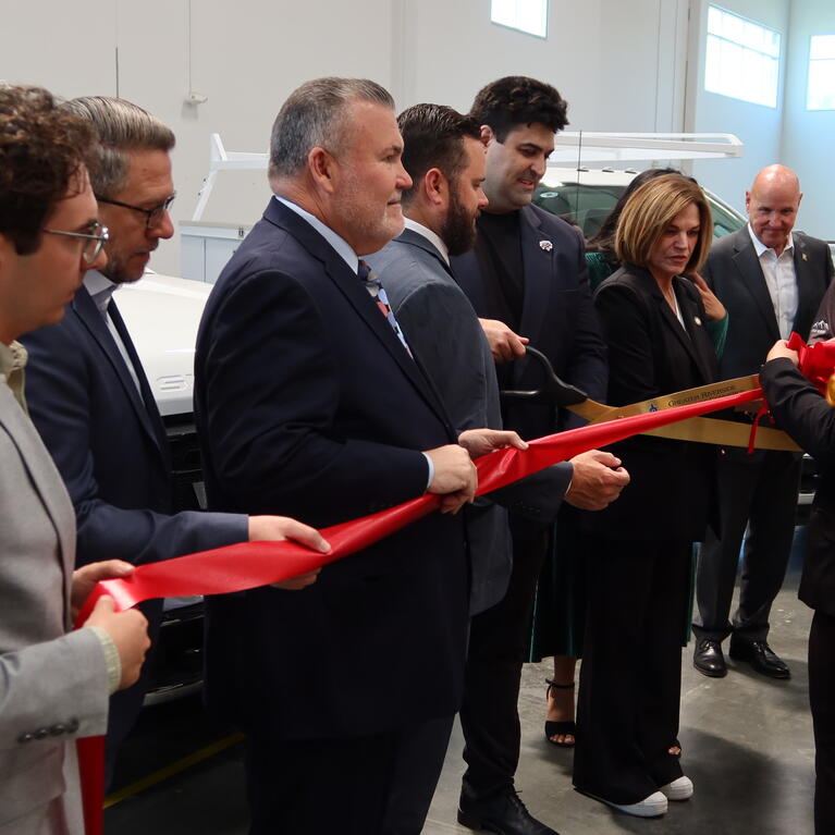 Voltu CEO George Gebhart cutting the ribbon alongside Riverside Mayor Patricia Lock-Dawson during the ribbon cutting ceremony at Voltu's new Riverside facility.